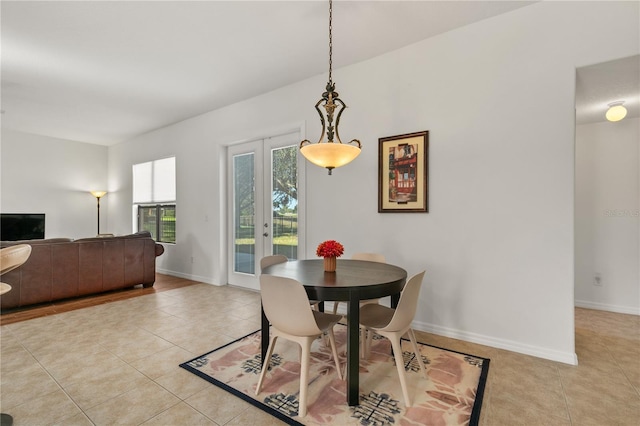 36711 Alaqua Ct, Eustis, FL 32736 - dining room with light tile patterned floors, baseboards, and french doors
