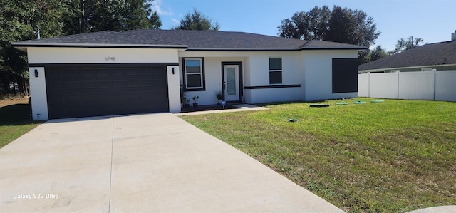 single story home with a front yard and a garage