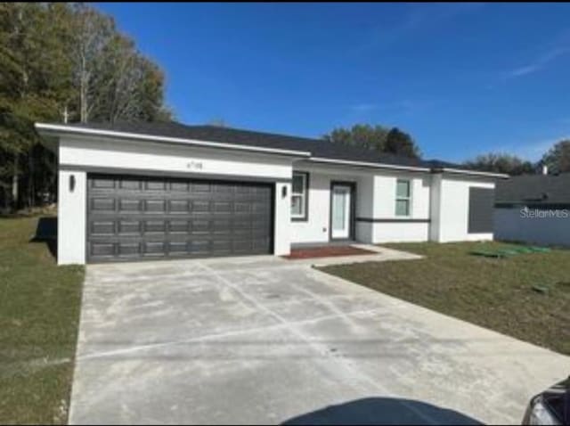 6748 Cherry Rd, Ocala, FL 34472 - ranch-style house featuring an attached garage, stucco siding, driveway, and a front yard