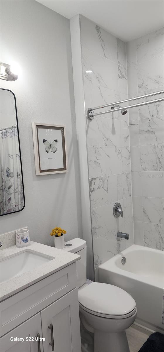 6748 Cherry Rd, Ocala, FL 34472 - full bathroom featuring toilet, shower / bath combo, and vanity