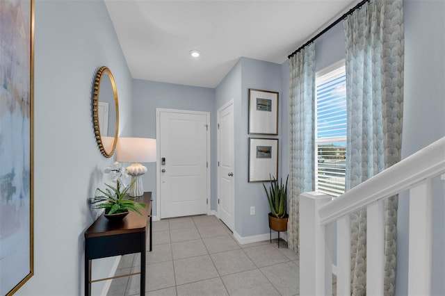 entrance foyer featuring light tile patterned floors