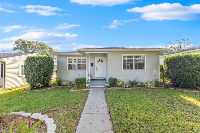 view of front of property with a front lawn