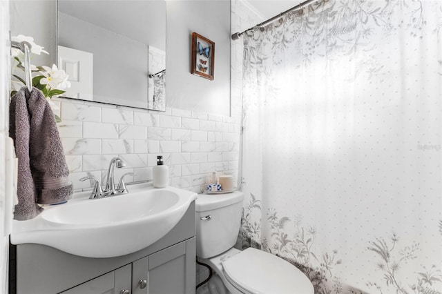 bathroom featuring vanity, tile walls, curtained shower, and toilet