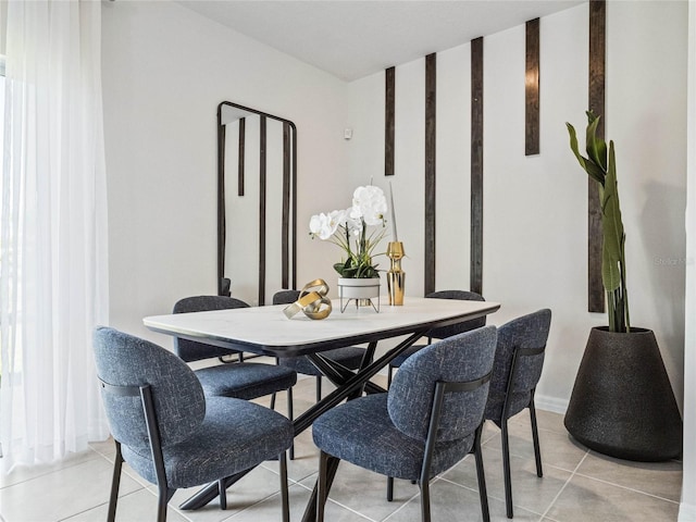 dining room with light tile patterned flooring