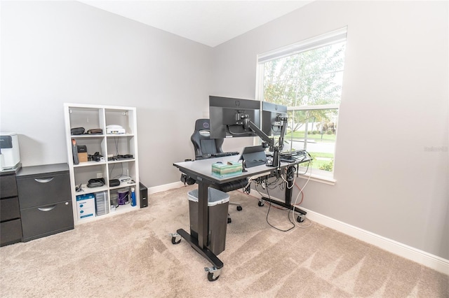 home office featuring a healthy amount of sunlight and light colored carpet