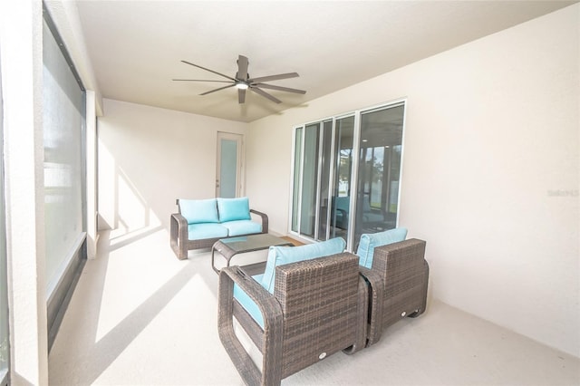 view of patio with an outdoor living space and ceiling fan