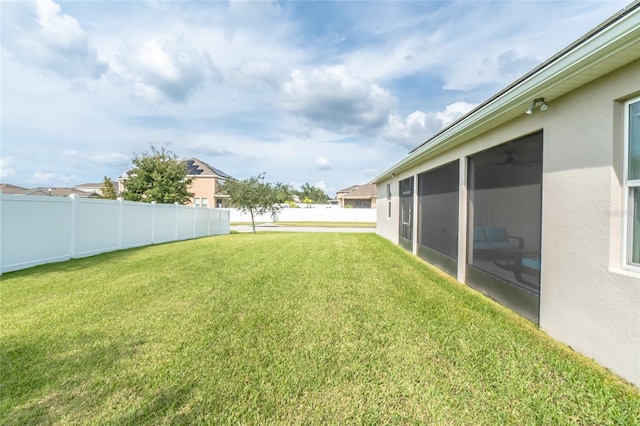 view of yard featuring a sunroom