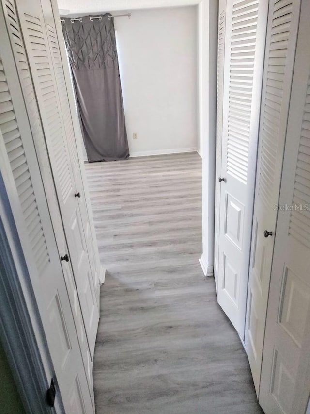 hallway featuring light hardwood / wood-style flooring