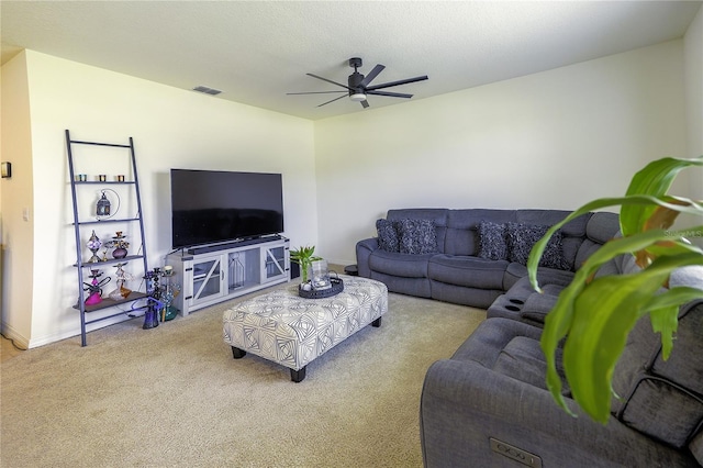 living room with ceiling fan and light colored carpet