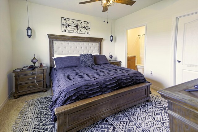 564 Boardwalk Ave, Haines City, FL 33844 - bedroom featuring carpet flooring, baseboards, connected bathroom, and ceiling fan