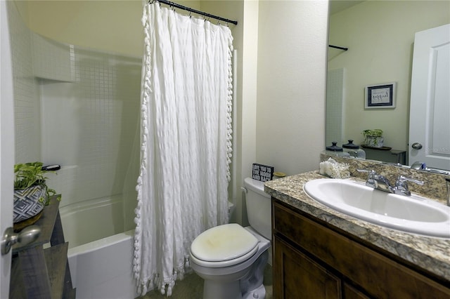 full bathroom featuring vanity, shower / bath combo with shower curtain, and toilet