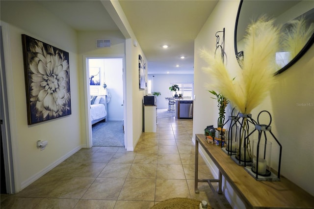 564 Boardwalk Ave, Haines City, FL 33844 - hallway with recessed lighting, light tile patterned flooring, and baseboards