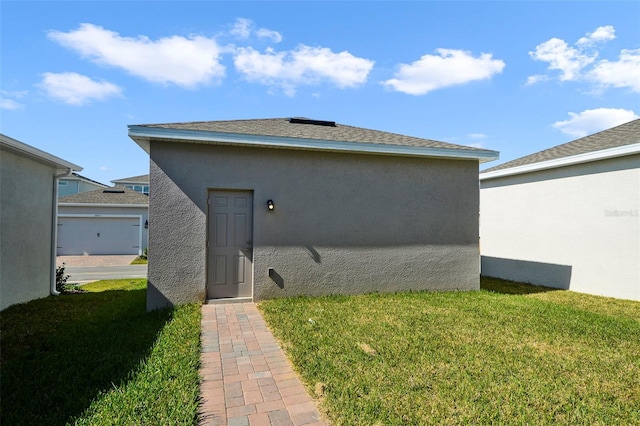 view of side of home with a yard