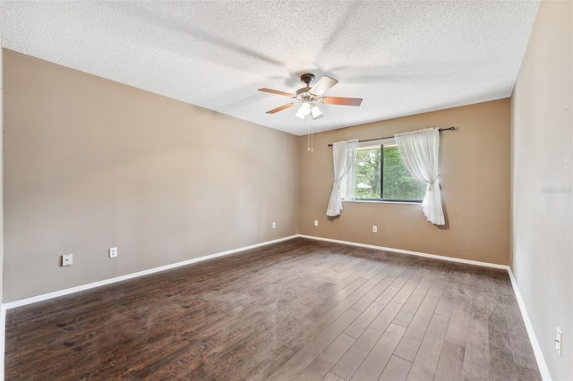 spare room featuring ceiling fan, a textured ceiling, and dark hardwood / wood-style flooring