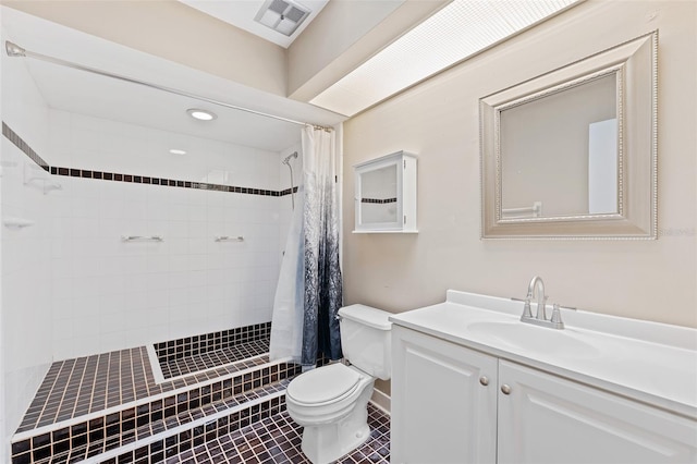 bathroom with vanity, toilet, tile patterned floors, and curtained shower