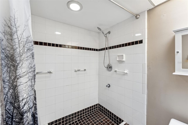 bathroom with a shower with shower curtain