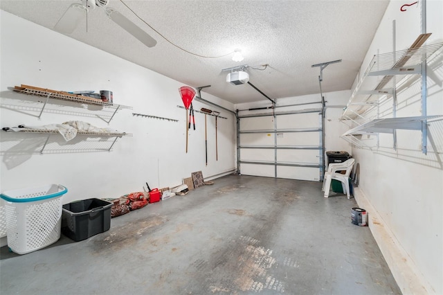 garage with a garage door opener and ceiling fan