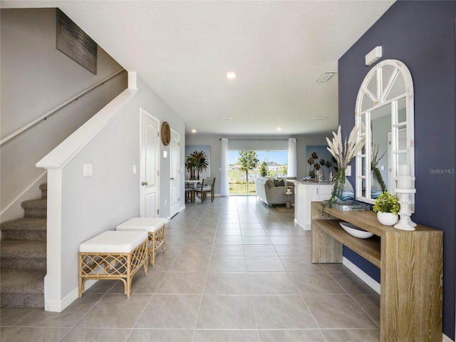 foyer with light tile patterned floors