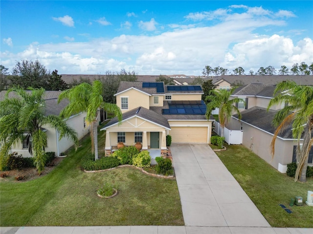 view of front of house with a garage and a front lawn