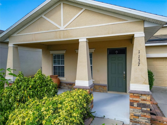 entrance to property with a porch