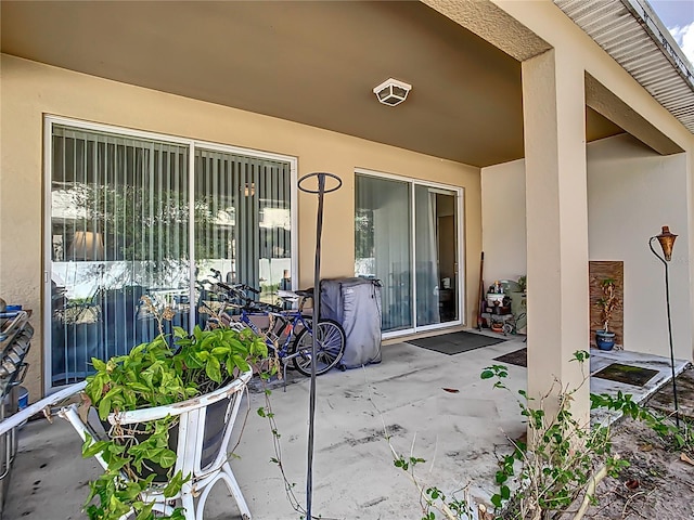 doorway to property featuring a patio area