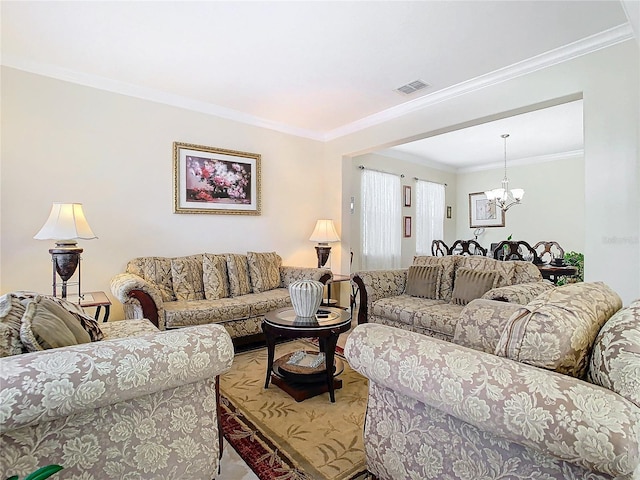 living room featuring crown molding and a notable chandelier