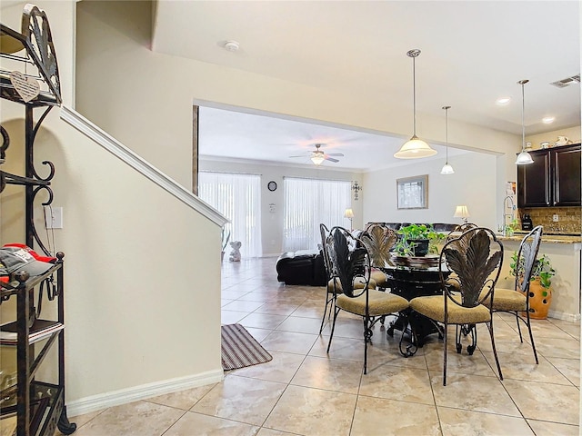 dining area with light tile patterned floors and ceiling fan