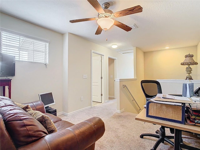 office space with ceiling fan and light colored carpet