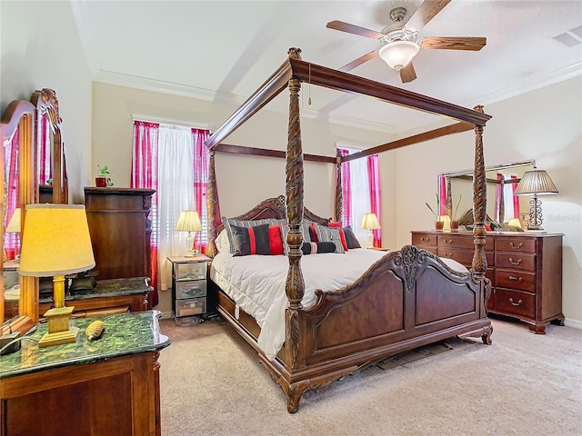 carpeted bedroom with crown molding and ceiling fan