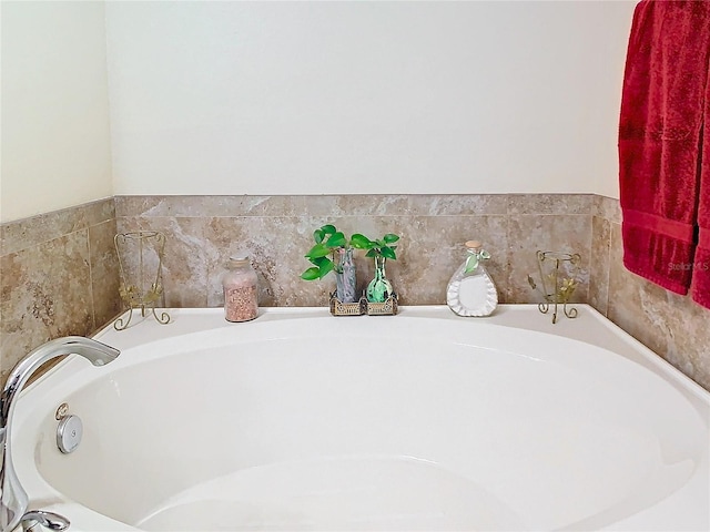 bathroom featuring a relaxing tiled tub