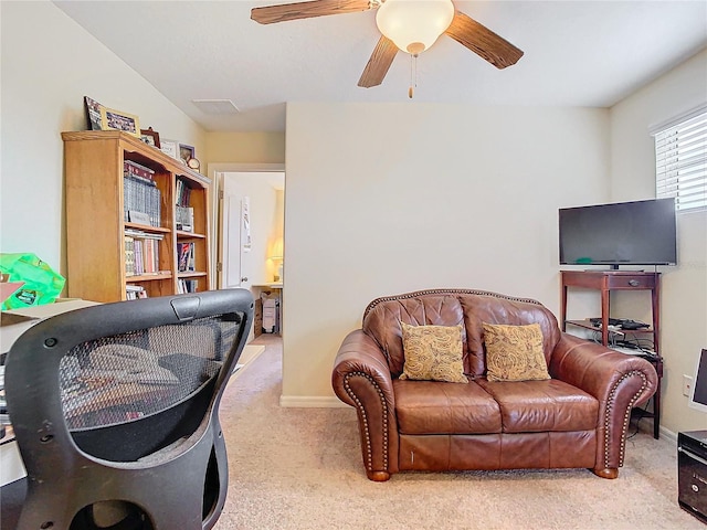 living room with ceiling fan and light carpet