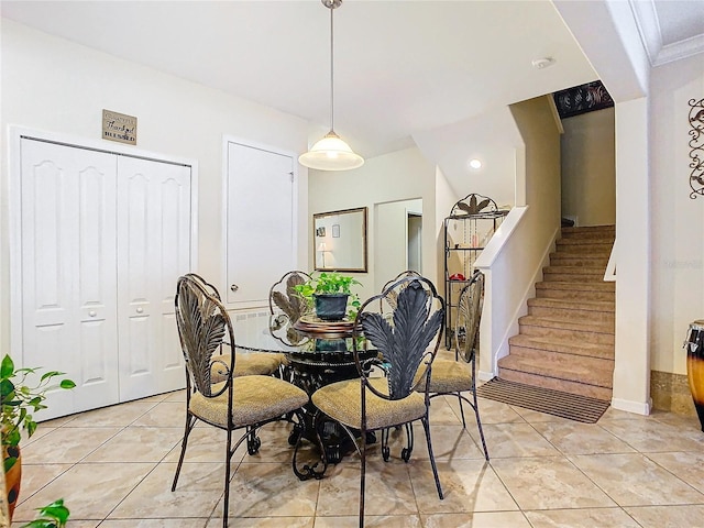 dining space featuring light tile patterned floors