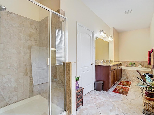 bathroom featuring vanity, plus walk in shower, and tile patterned flooring