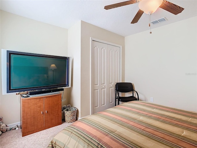 bedroom featuring carpet, a closet, and ceiling fan