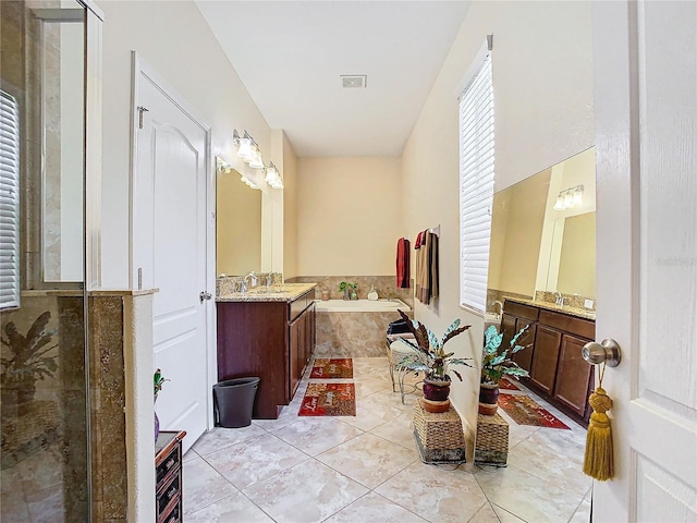 bathroom featuring vanity, tile patterned floors, and independent shower and bath