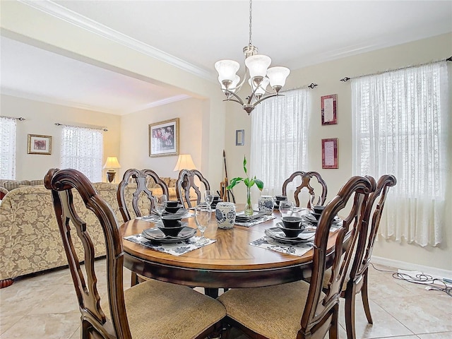 dining area featuring crown molding, a chandelier, light tile patterned floors, and a wealth of natural light