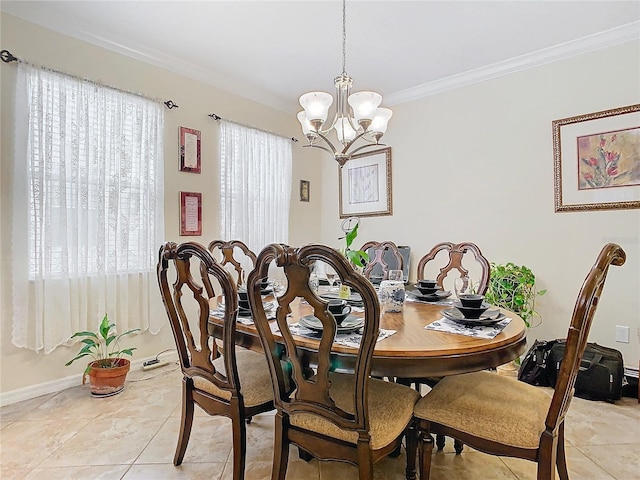 dining room with crown molding, light tile patterned flooring, and a notable chandelier