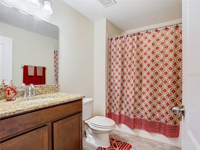 full bathroom featuring a textured ceiling, toilet, vanity, shower / tub combo with curtain, and tile patterned flooring