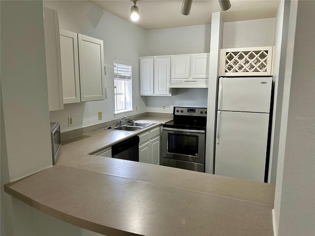 kitchen with white cabinetry, appliances with stainless steel finishes, sink, and kitchen peninsula