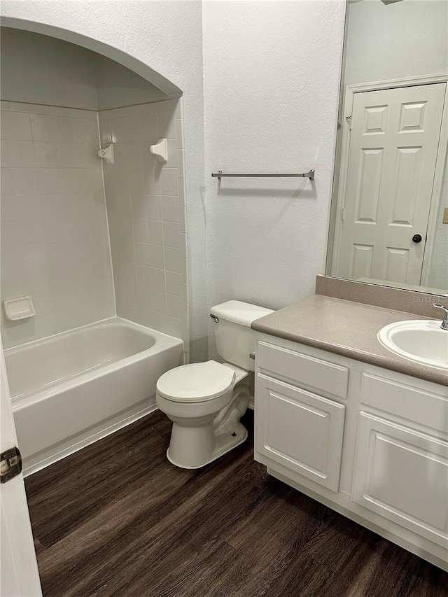 full bathroom with vanity, shower / tub combination, and hardwood / wood-style floors