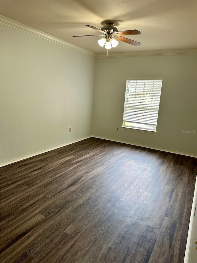 unfurnished room with crown molding, dark wood-type flooring, and ceiling fan