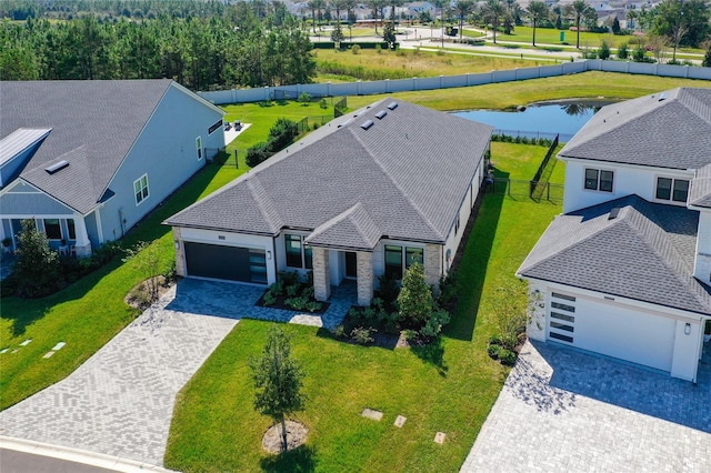 birds eye view of property with a water view