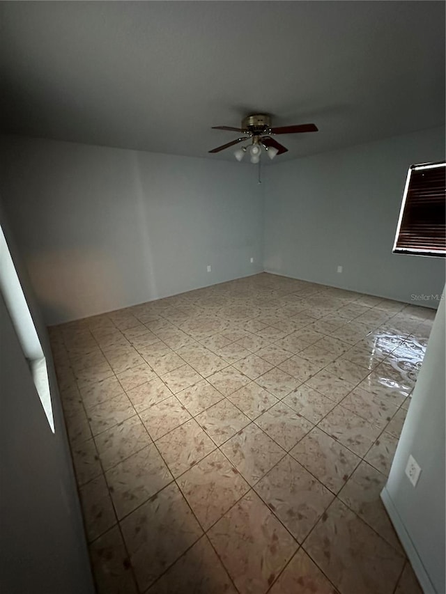 spare room with ceiling fan