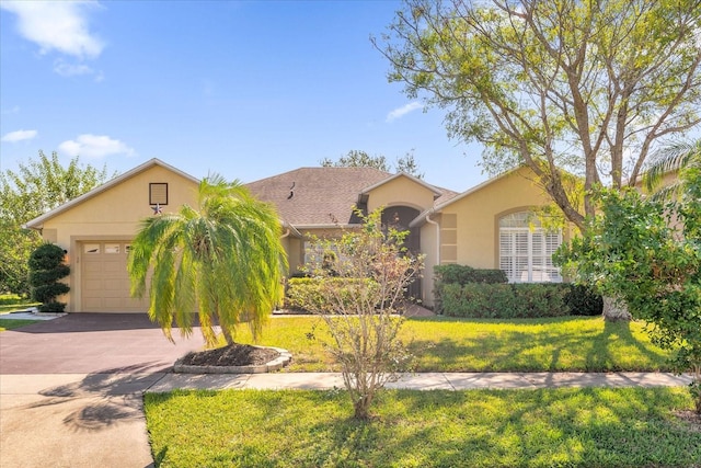 ranch-style home with a garage and a front lawn