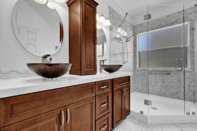 bathroom featuring vanity and a shower with shower door