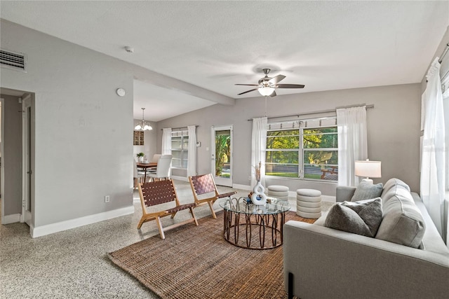 living room featuring a textured ceiling, lofted ceiling with beams, and ceiling fan with notable chandelier