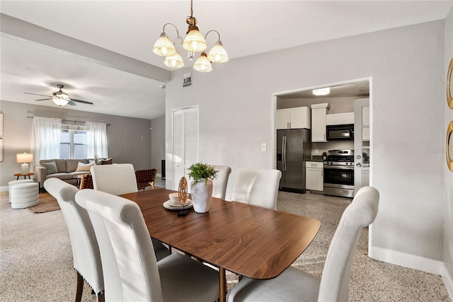 dining space featuring ceiling fan with notable chandelier