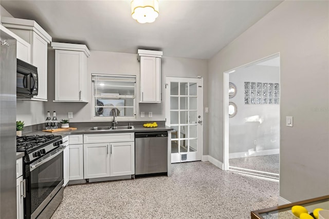 kitchen with white cabinets, stainless steel appliances, and sink