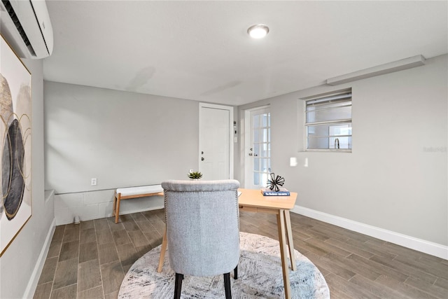 dining area featuring dark hardwood / wood-style floors and a wall mounted AC