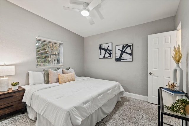 bedroom with ceiling fan, light carpet, and vaulted ceiling